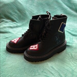 Stylish Black Boots with Red and Blue Patches